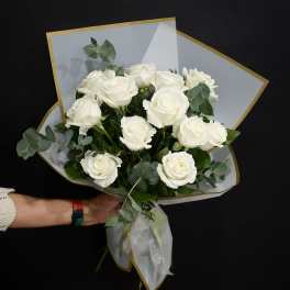 Bouquet of white roses with eucalyptus in white wrap