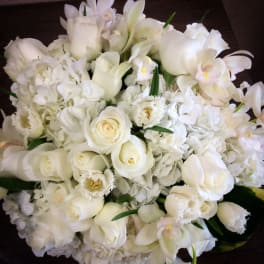 White bouquet with roses, hydrangeas, and orchids