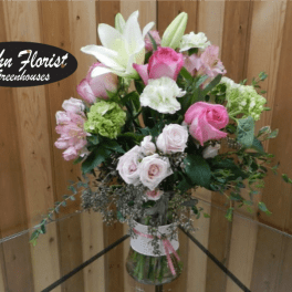 Pink and white mixed bouquet in a glass vase