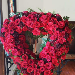 Heart-shaped rose wreath on an easel