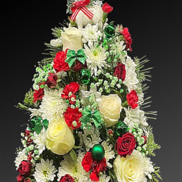 Christmas tree-shaped floral arrangement with red and white flowers
