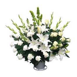 White lilies and carnations in a gray vase