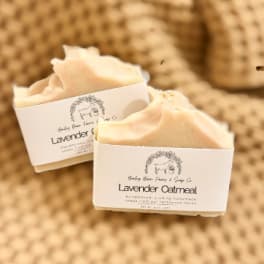 Two bars of lavender oatmeal soap with labels