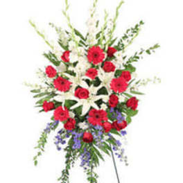 Standing spray of red and white flowers with purple accents