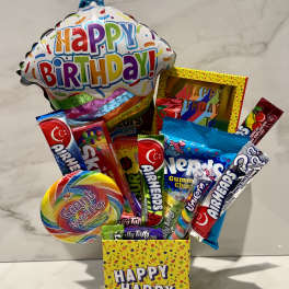 Birthday candy gift box with a balloon and assorted sweets