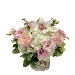 Pink and white bouquet in a clear glass vase