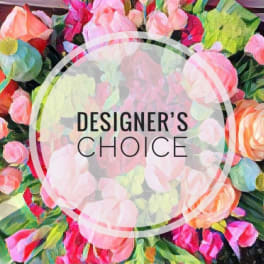Colorful mixed flower bouquet with a "Designer’s Choice" label