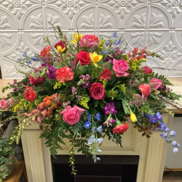 Large mixed bouquet with pink and red roses and bright accent flowers