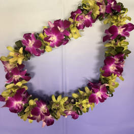 Purple and yellow orchid lei on a light background