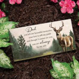 Sympathy card with a deer illustration resting on dark mulch and pink flowers