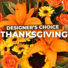 Orange lilies and yellow daisies with roses and a Thanksgiving sign