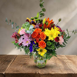 Colorful mixed bouquet in a clear glass vase