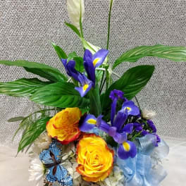 Bouquet with yellow roses, purple irises, and white peace lilies
