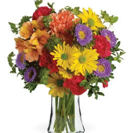 Colorful mixed bouquet in a clear glass vase