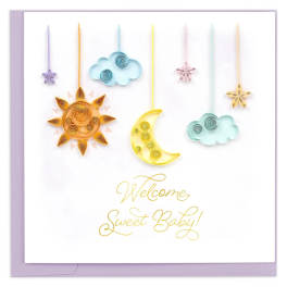 Baby shower card with hanging sun, moon, cloud, and star decorations