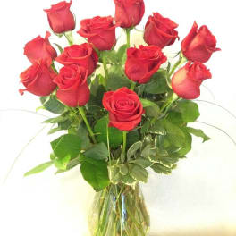 Bouquet of red roses in a clear glass vase