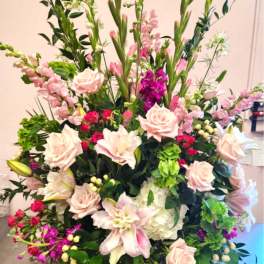 Large mixed flower arrangement with pink roses and lilies