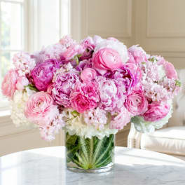 Pink and white mixed bouquet in a clear glass vase