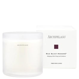 White three-wick candle in a frosted glass jar with a box behind it