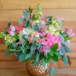 Pink and white mixed bouquet in a hammered gold vase