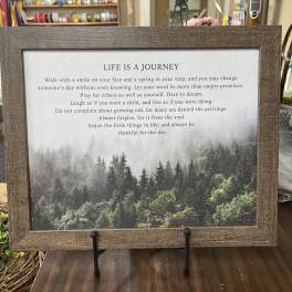 Framed inspirational quote print with a forest landscape