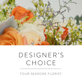 Orange and white roses with small white filler flowers