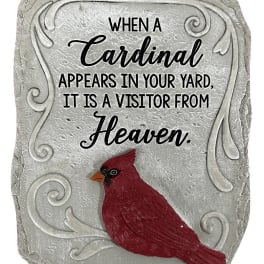 Decorative stone plaque with a red cardinal and memorial text