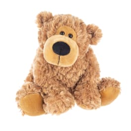 Plush teddy bear sitting on a white background
