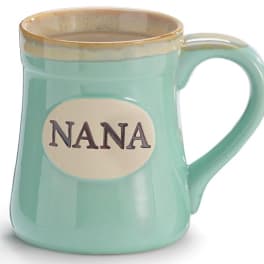 Mint green ceramic mug with the word "NANA" on a cream oval plaque.