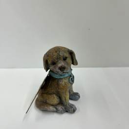Small decorative dog figurine with a blue collar