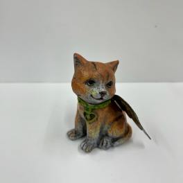 Small painted cat figurine with a green collar and feather wing