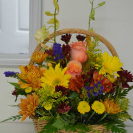 Mixed flower basket with roses, daisies, and chrysanthemums
