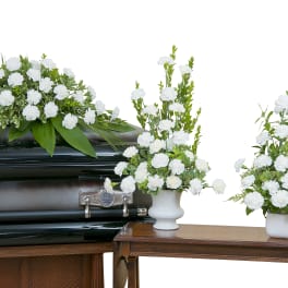 sympathy of carantions includes casket spray, urn and coordinating arrangement