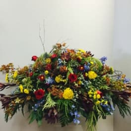 Large colorful floral arrangement with mixed blooms and greenery