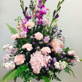 Tall pastel floral spray with pink and purple blooms