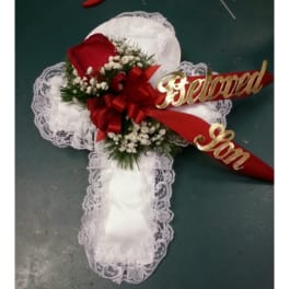 White lace cross with red roses and ribbon