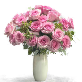 Pink rose bouquet in a tall white vase