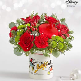 Red floral arrangement in a Disney Mickey and Friends container