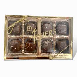 Box of chocolate sea salt caramels with a gold ribbon