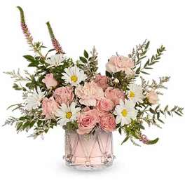 Pink roses and white daisies in a clear glass vase