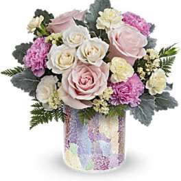 Pink and white rose bouquet in a pastel mosaic vase