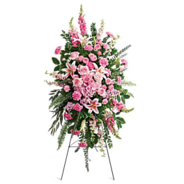 Pink floral standing spray on an easel