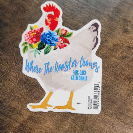 Chicken-shaped sticker with colorful flowers and text