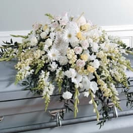 White floral casket spray with cascading blooms
