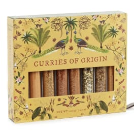 Boxed set of curry spice blends with a yellow illustrated package