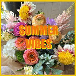 Colorful bouquet with roses, ranunculus, and yellow daisy-like blooms