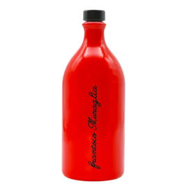 Red bottle with a black cap and vertical black text