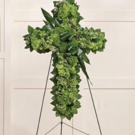 Green floral cross on a standing easel