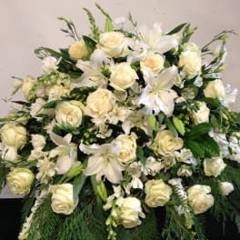 Large white floral spray with roses and lilies