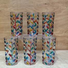 Six clear glass tumblers with colorful leaf patterns